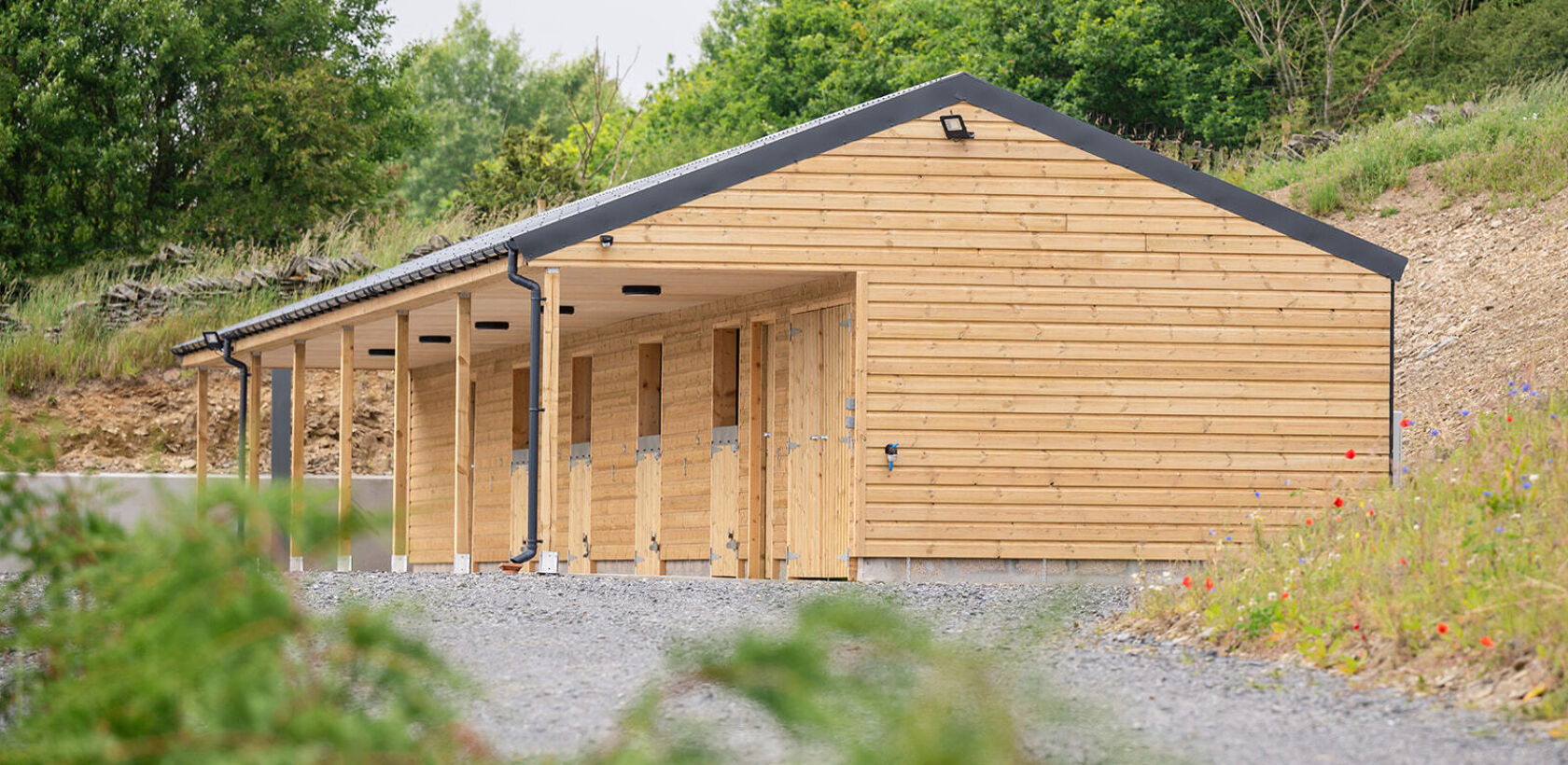Modern stable block with individual stables for guests bringing their horses on holiday to Logie Newton Lodges.
